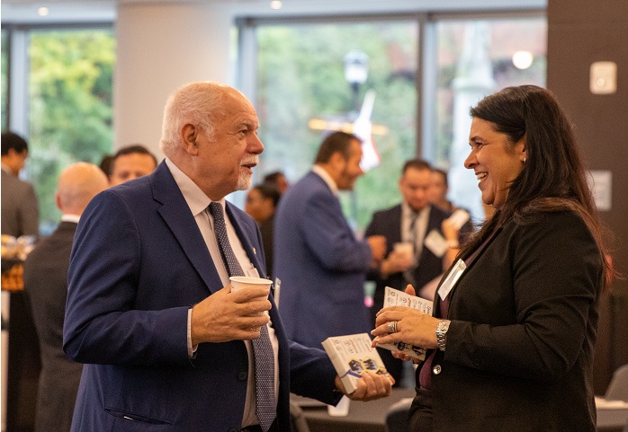 Attendees networking in lobby